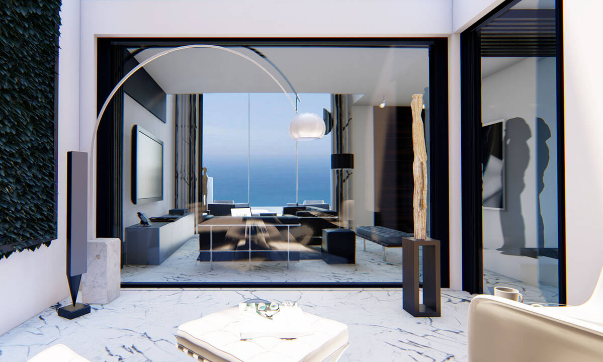 Living room with double height and sea views