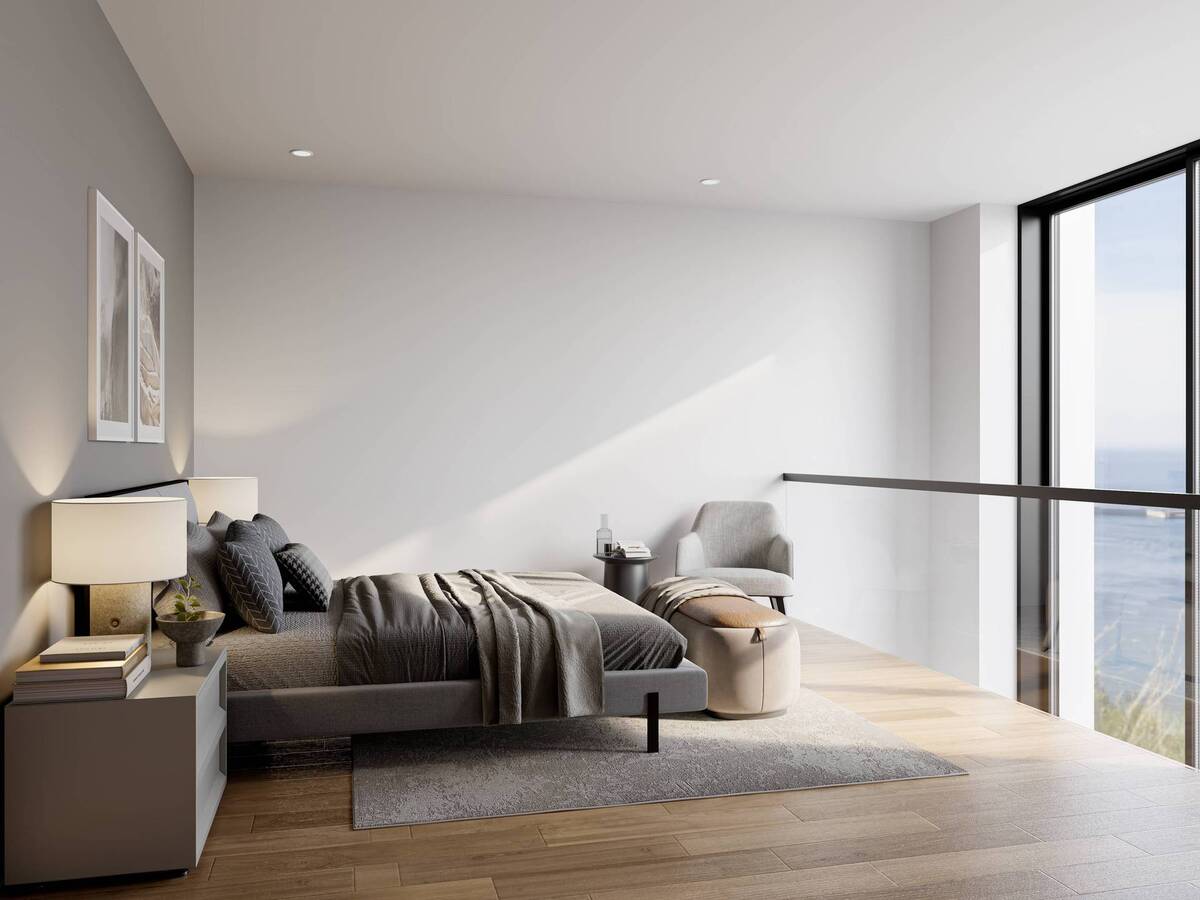 Bright master bedroom with sea views