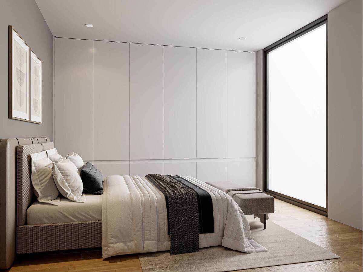 Bedroom with built-in wardrobe and natural light