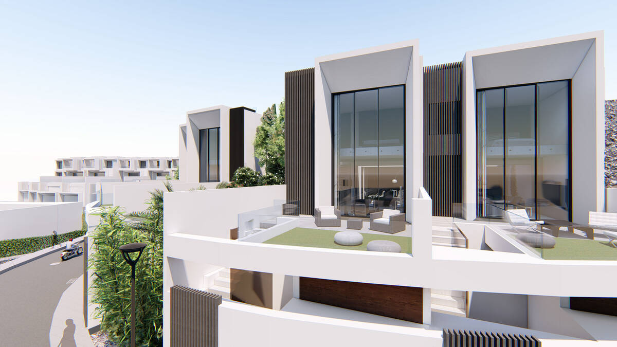 Private terrace with artificial grass and tall windows