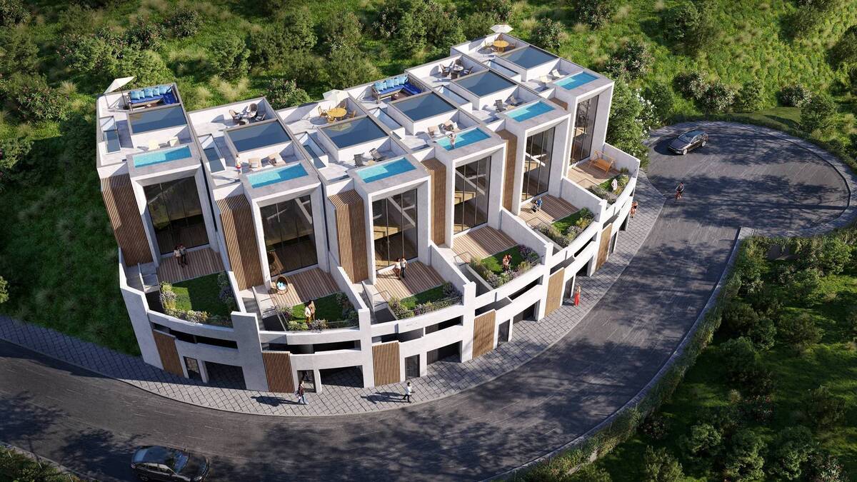 Aerial view of the residential complex with rooftop pools