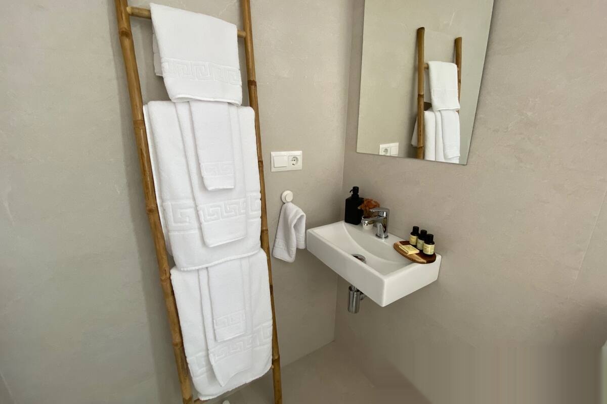 Bathroom sink with towels and mirror