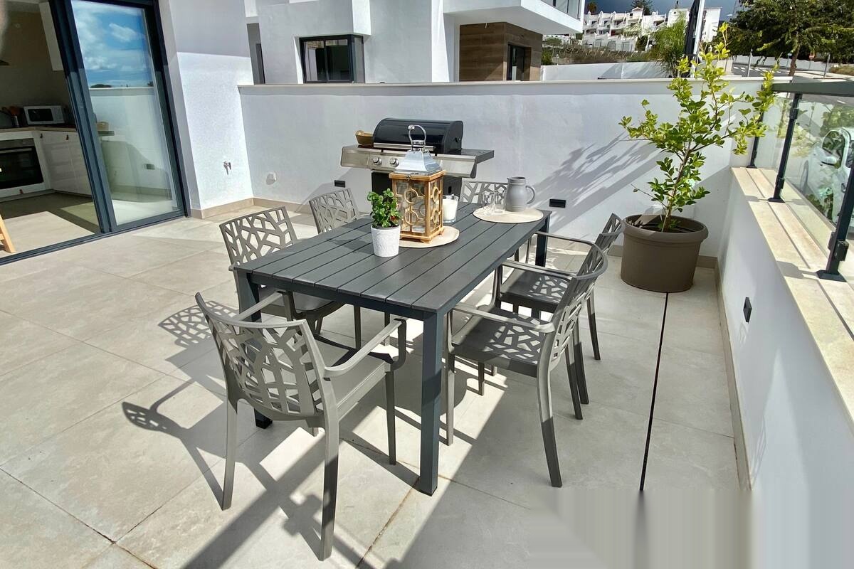 Outdoor dining area on sunny terrace