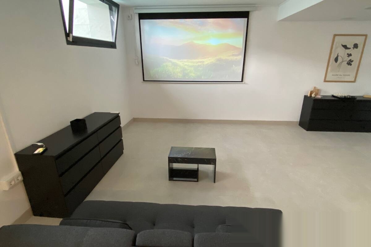 Entertainment room with projector and side cabinets