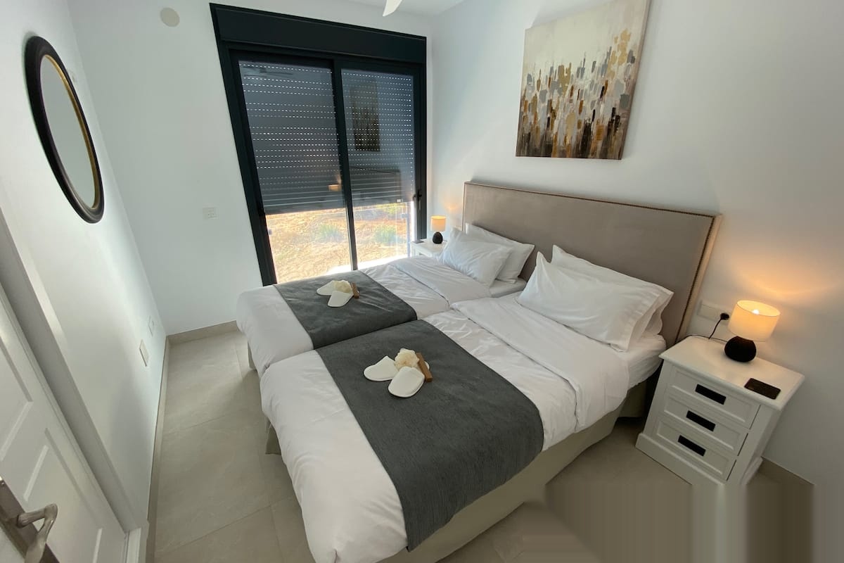 Double bedroom with window and minimalist decor