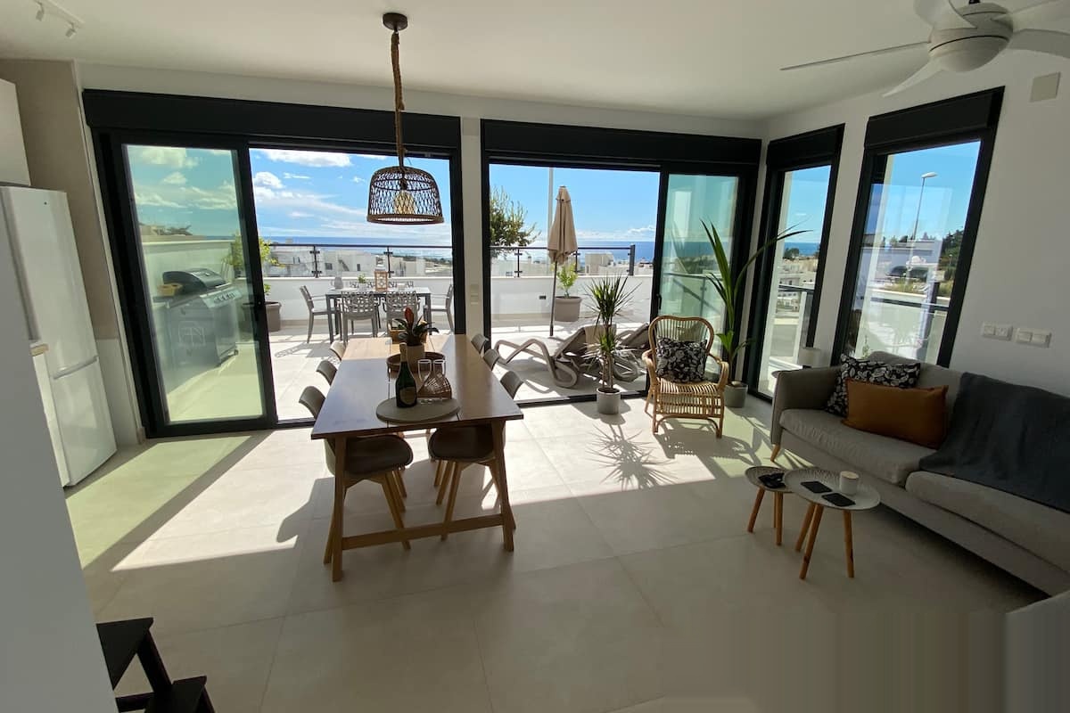 Open living-dining room with terrace access