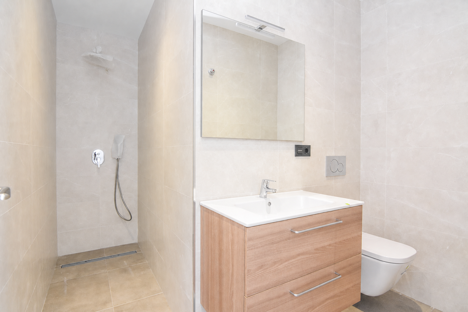 Bathroom with shower, vanity unit and toilet