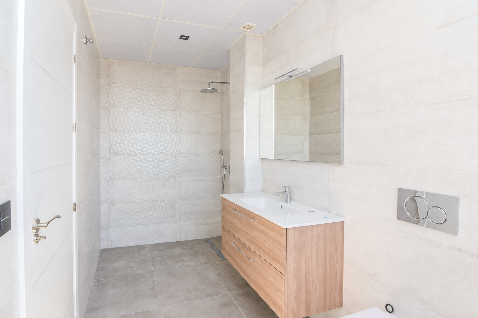 Bathroom with shower, sink and modern mirror