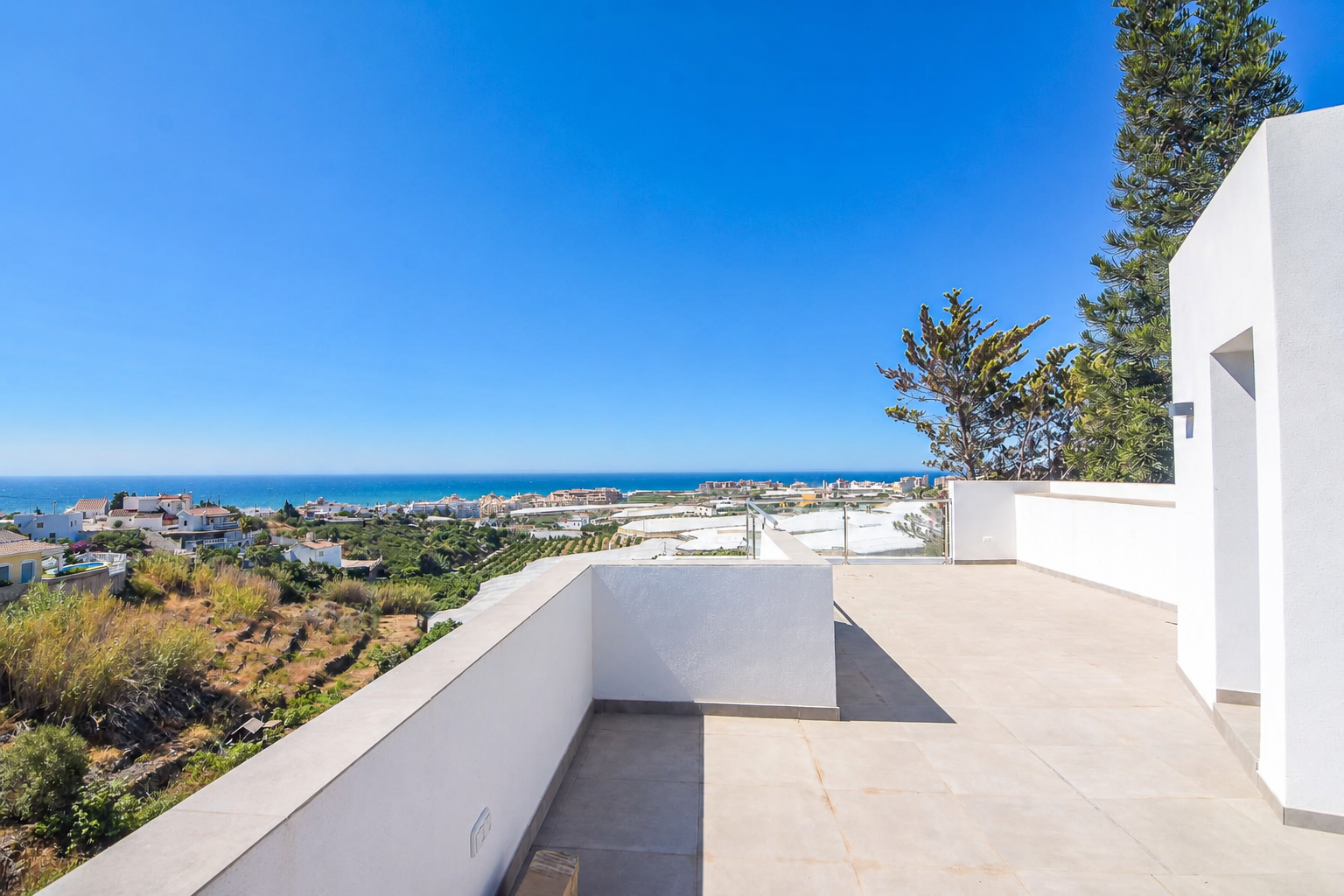 Spacious terrace with sea views and glass railing